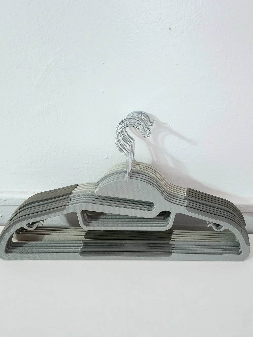 10 Slim Non-Slip Plastic Hangers in Light Gray